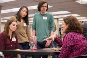 students speak with librarian